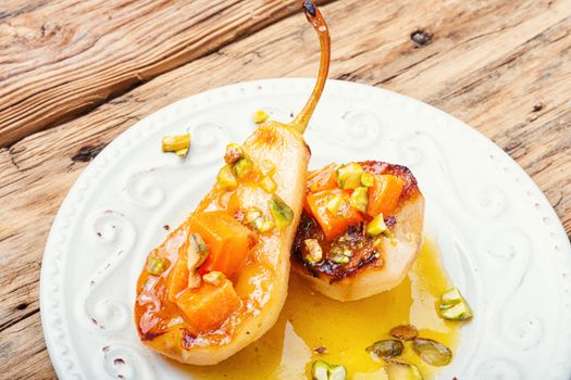 Stuffed pear pumpkin and pistachio.Baked pear.Caramelized pear with nuts