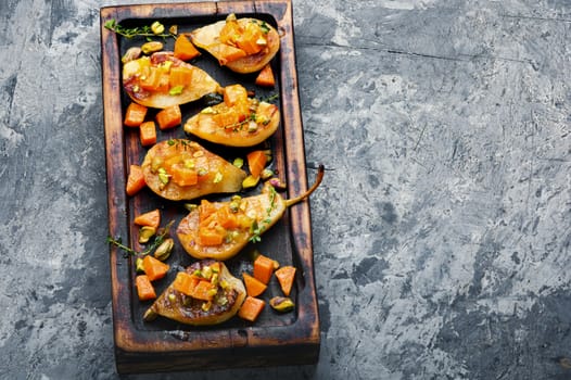 Stuffed pear pumpkin and pistachio.Baked pear.Autumn food.