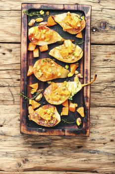 Stuffed pear pumpkin and pistachio.Baked pear.Autumn food.