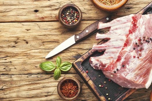 Pork meat on chopping board ready for cooking