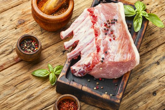 Pork meat on chopping board ready for cooking