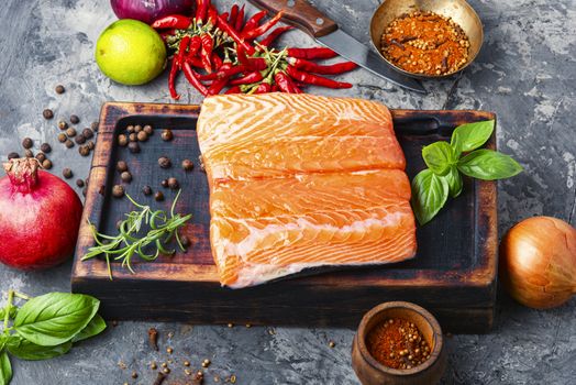 Fresh raw salmon fillet with cooking ingredients