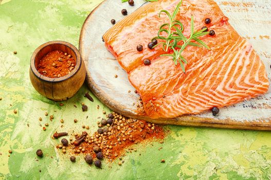 Fresh raw salmon fillet with cooking ingredients