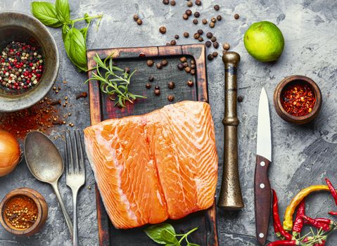 Fresh raw salmon fillet with cooking ingredients.Fresh fish