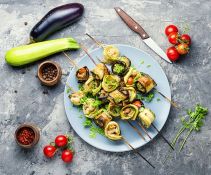 Eggplant and zucchini stuffed with meat on skewers.Flat lay.Vegetarian skewers