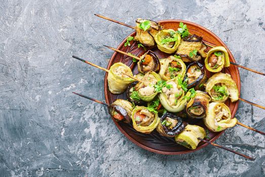 Eggplant and zucchini stuffed with meat on skewers.Grill menu