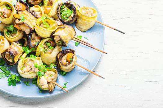 Eggplant and zucchini stuffed with meat on skewers.Banquet snack