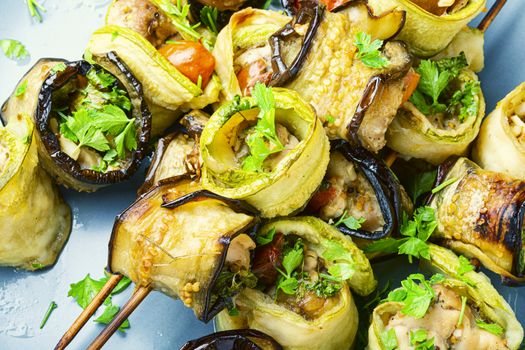 Eggplant and zucchini stuffed with meat on skewers