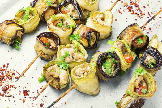 Eggplant and zucchini stuffed with meat on skewers