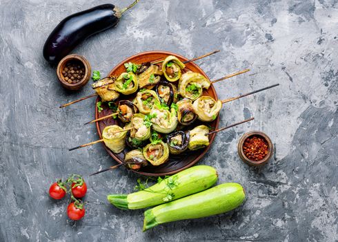 Eggplant and zucchini stuffed with meat on skewers.Flat lay.Vegetarian skewers