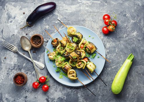 Eggplant and zucchini stuffed with meat on skewers.Flat lay.Vegetarian skewers