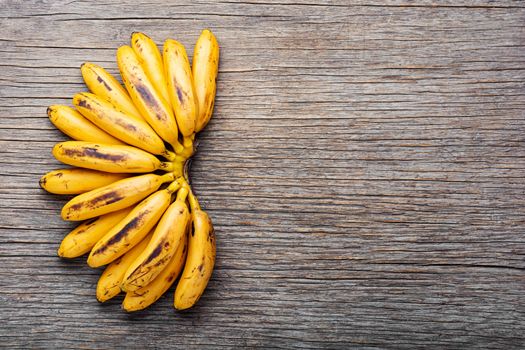 Bananas on an old wooden table.A bunch of ripe bananas.