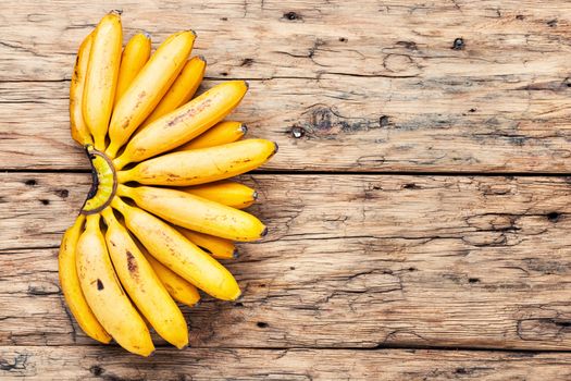 Bananas on an old wooden table.A bunch of ripe bananas.