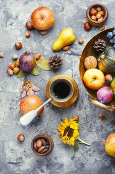 Autumn composing with pumpkin, fruit and fall leaves.Autumn still life