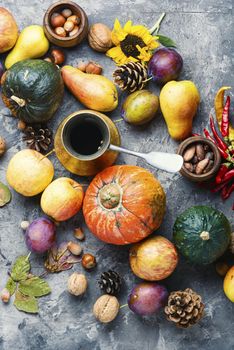 Autumn composing with pumpkin, fruit and fall leaves.Fall still life