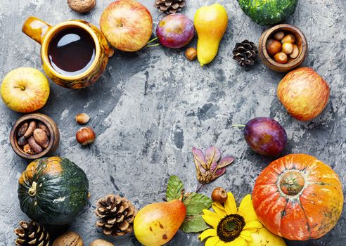 Autumn composing with pumpkin, fruit and fall leaves.Autumn background