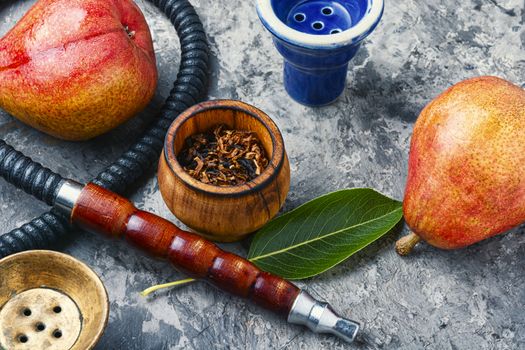 Smoking hookah.Details of Turkish kalian.Shisha with a fruity aroma of tobacco.