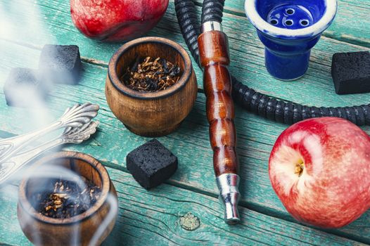 Smoking hookah.Details of Turkish kalian.Shisha with a fruity aroma of tobacco.