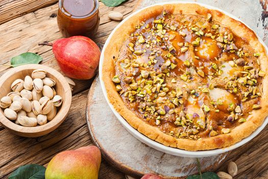 Autumn pie with pear and pistachio.Traditional autumn pie