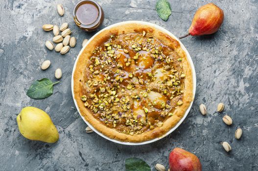 Autumn pie with pear and pistachio.Traditional autumn pie