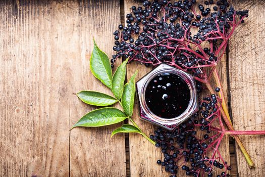 Elderberry jam and fresh berries.Homemade jam.Space for text