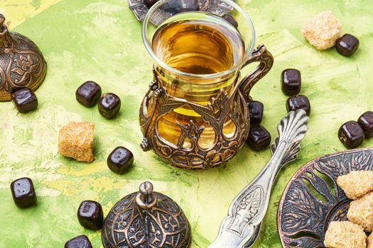 Cups of turkish tea with oriental sweets.Eastern tea