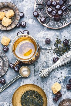 Cups of turkish tea with oriental sweets.Eastern tea