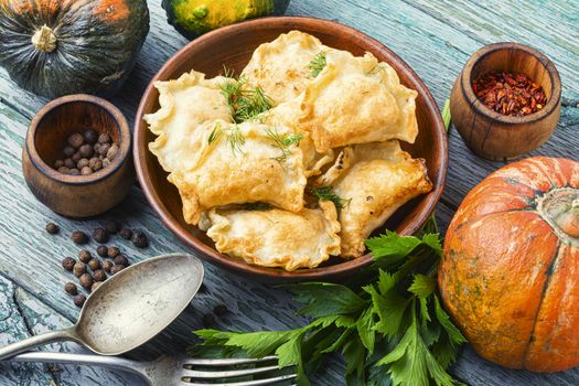 Traditional pumpkin dumplings or vareniki.Fried pumpkin vareniki.Autumn food