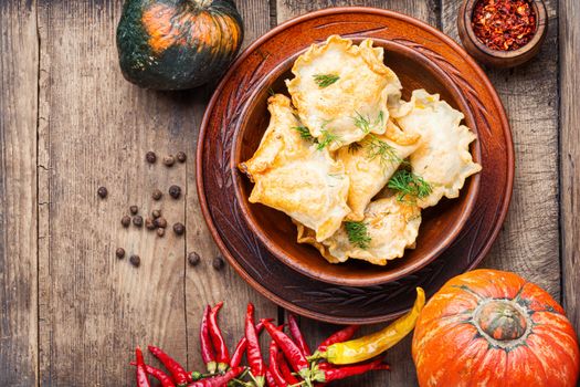 Traditional autumnal pumpkin dumplings.Fried pumpkin vareniki.Autumn food