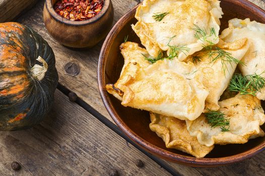 Traditional pumpkin dumplings or vareniki.Fried pumpkin vareniki.Autumn food