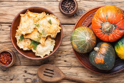 Traditional autumnal pumpkin dumplings.Fried pumpkin vareniki.Autumn food