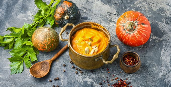 Vegetarian autumn pumpkin cream soup.Seasonal autumn food