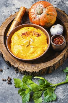 Vegetarian autumn pumpkin cream soup.Pumpkin soup and organic pumpkins