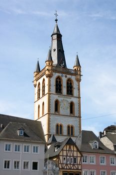 Tower with weather vane and a beautiful clock