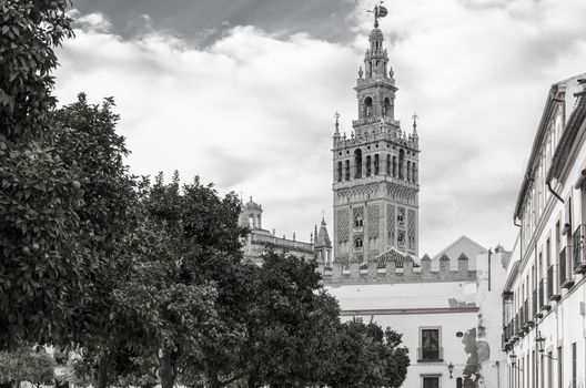 The Giralda is the bell tower of the Seville Cathedral in Seville, Spain. It was originally built as the minaret for the Great Mosque of Seville in al-Andalus, Moorish Spain, during the reign of the Almohad dynasty, with a Renaissance-style top subsequently added by the Catholics after the expulsion of the Muslims from the area.