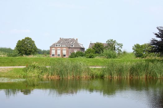 Lonely old House, with a body of water in the foreground