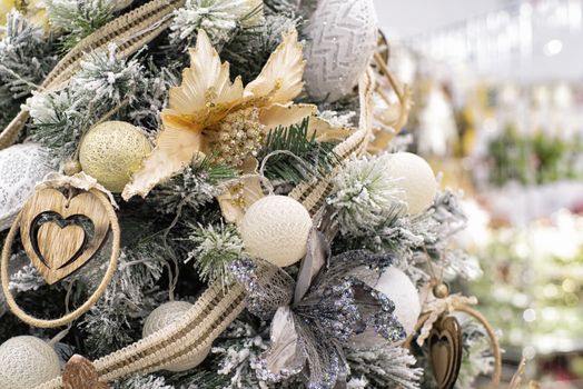 The decor on the Christmas tree on which the New Year's toys are hanging . Xmas concept. soft selective focus