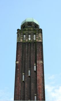 a tower built of red brick stones 