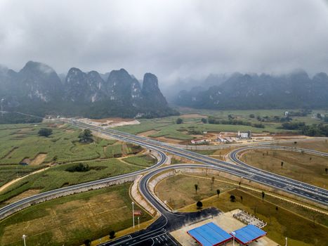 The Huashan service area of the Chongshui Expressway S62 in karst mountains of Guangxi, China.