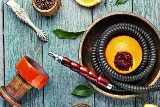 Details of tobacco hookah and tobacco with orange aroma.Fruit shisha