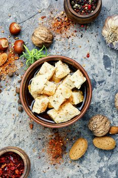 Feta cheese with herbs and garlic in bowl