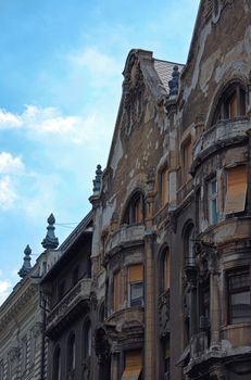 Side view of old buildings in Budapest, Hungary, on a beautiful day with clear blue sky.