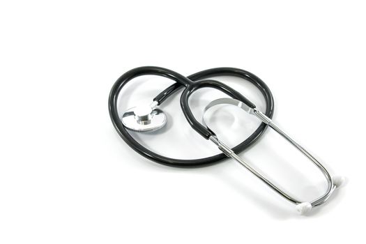 Stethoscope curved into the shape of a heart on white background