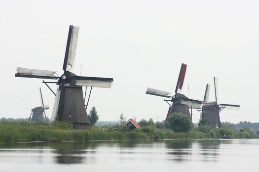 A beautiful, old, historic windmill, with four wings 