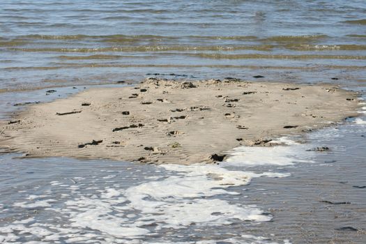 A washed by water small sandy island