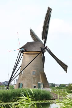 A beautiful, old, historic windmill, with four wings 