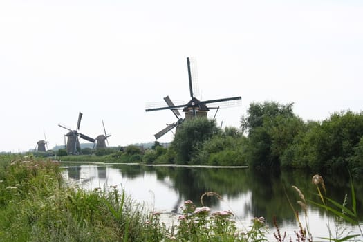 A beautiful, old, historic windmill, with four wings 