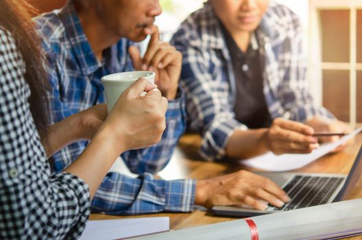 Close-up of  business people working on project together. Teamwork , hipster tone