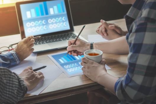 Close-up of  business people working on project together. Teamwork , hipster tone