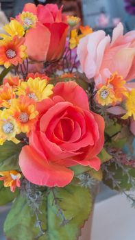 colorful of the plastic flowers bouquet , soft of focus